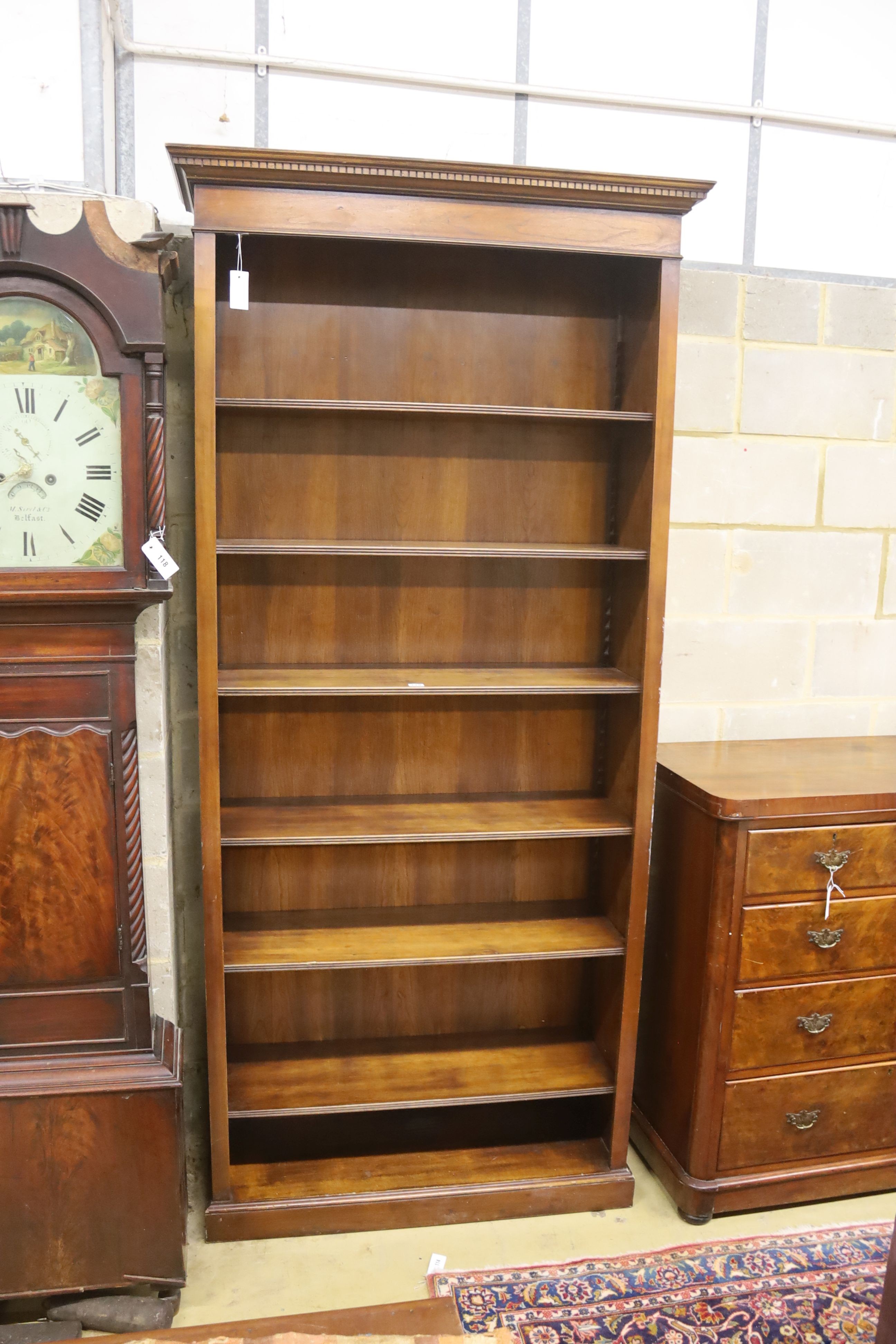 A reproduction mahogany open bookcase, length 102cm, depth 33cm, height 229cm